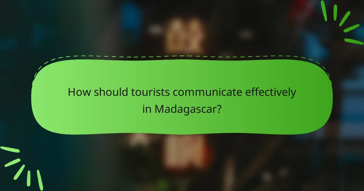 How should tourists communicate effectively in Madagascar?